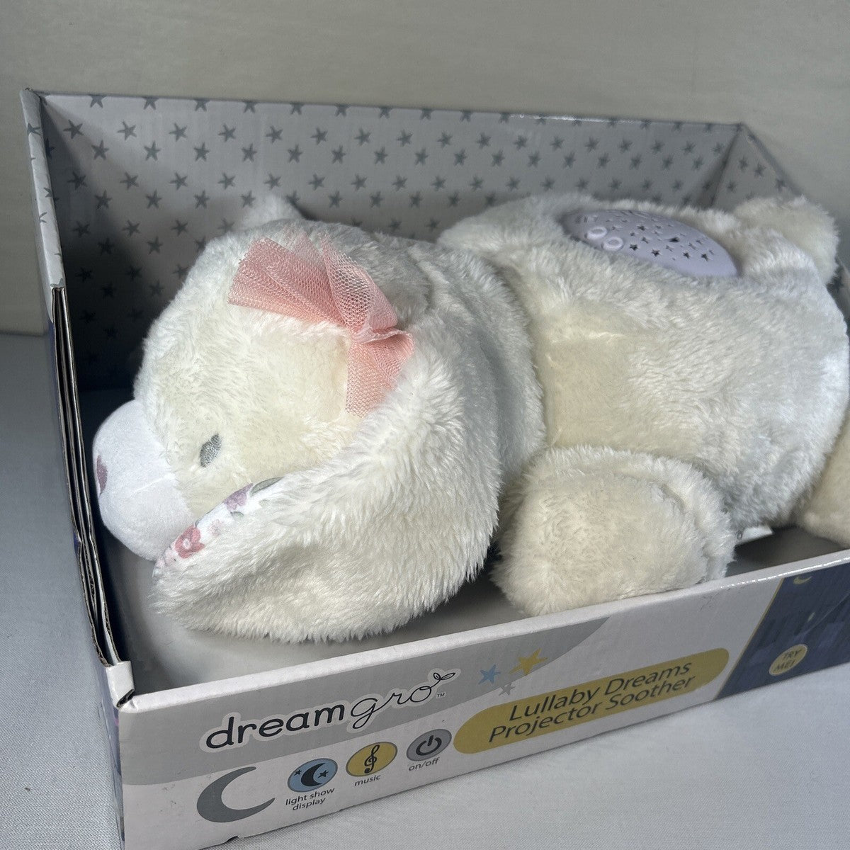 Peluche proyector de luz y sonido